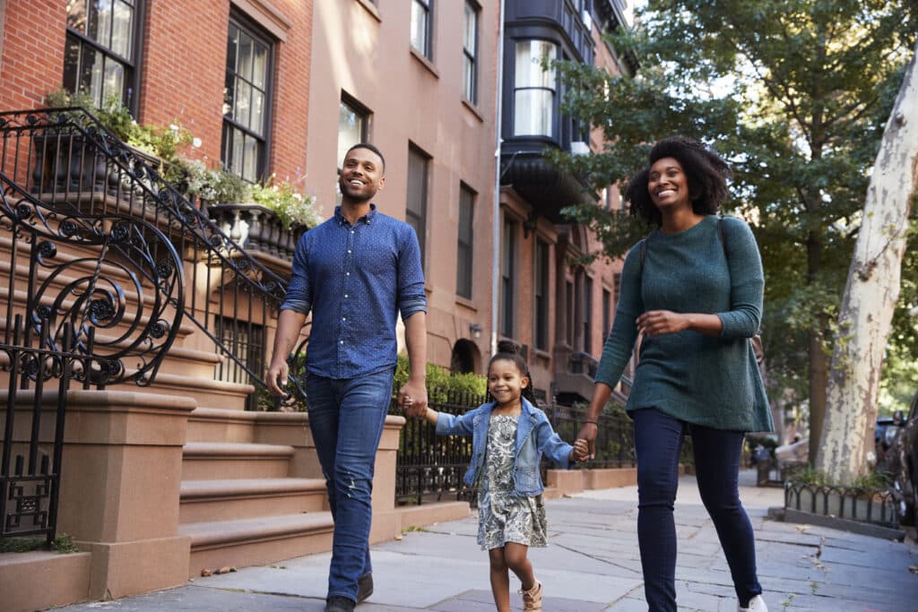 Family taking a walk down the street, close up