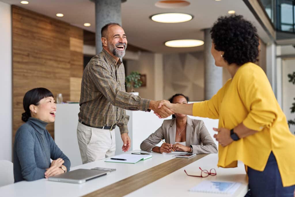 business meeting businessman office teamwork businesswoman handshake agreement applause hand shake shaking man applauding colleague group seminar conference